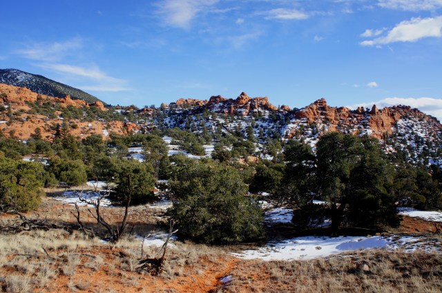 Trail crosses a dry wash en route to the ridgeline ahead