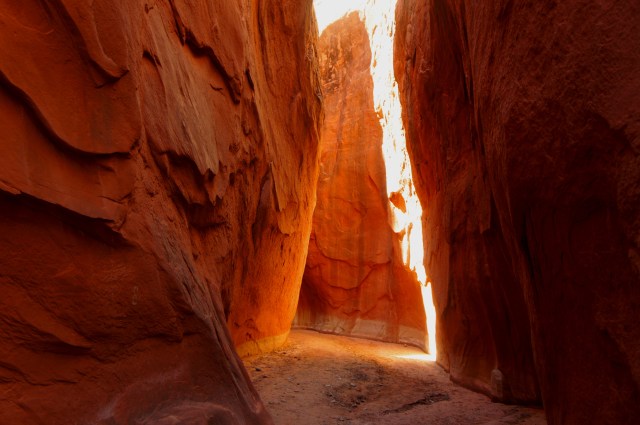 Light shines through the Dry Fork Narrows, near the entrance
